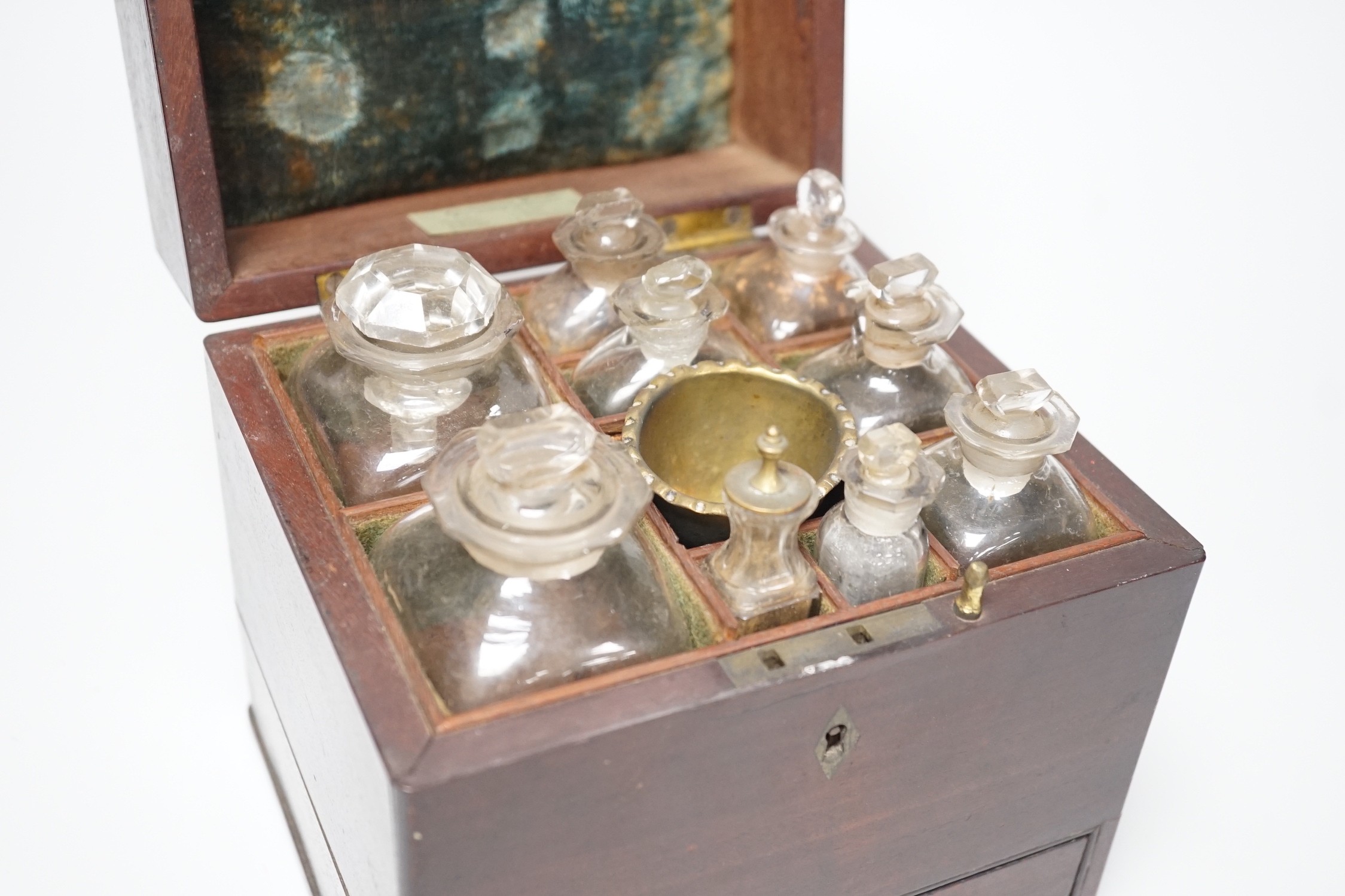 A George III mahogany cased travelling apothecary set with glass flasks, 19cm high
